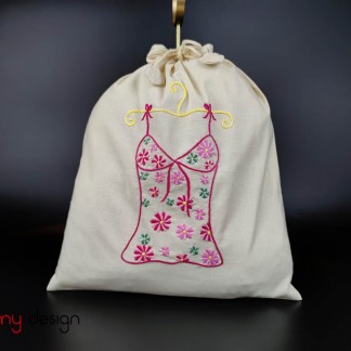 Laundry bag with flower embroidered shirt